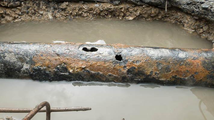Corroded pipe leaking under a slab in a Atlanta home
